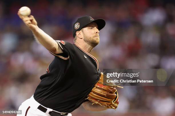 Starting pitcher Merrill Kelly of the Arizona Diamondbacks pitches against the Boston Red Sox during the second inning of the MLB game at Chase Field...