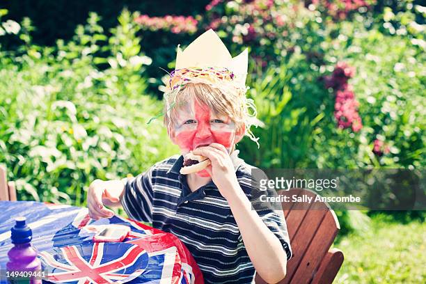 boy eating burger at barbeque - burger with flag stock pictures, royalty-free photos & images