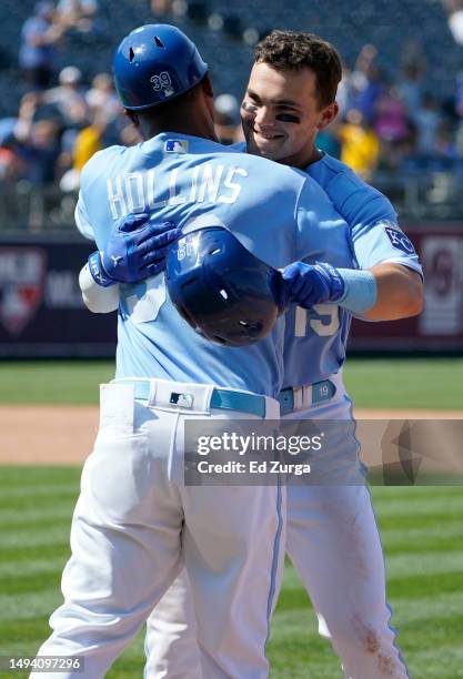 Michael Massey of the Kansas City Royals celebrates his walk-off single with Damon Hollins of the Kansas City Royals in the ninth inning against the...