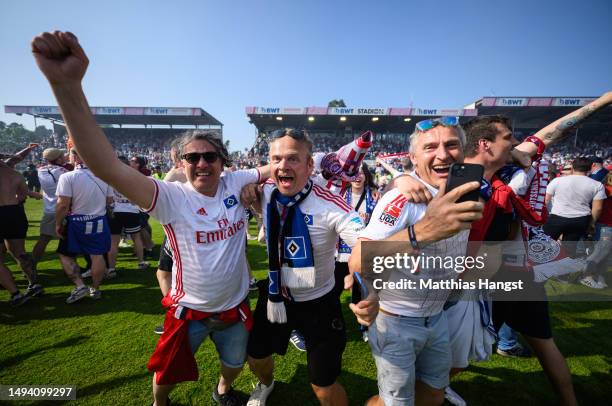 Hamburger SV fans celebrate after the team's victory, before 1. FC Heidenheim 1846 scored a last minute goal, to confirm Hamburger SV's 3rd place...