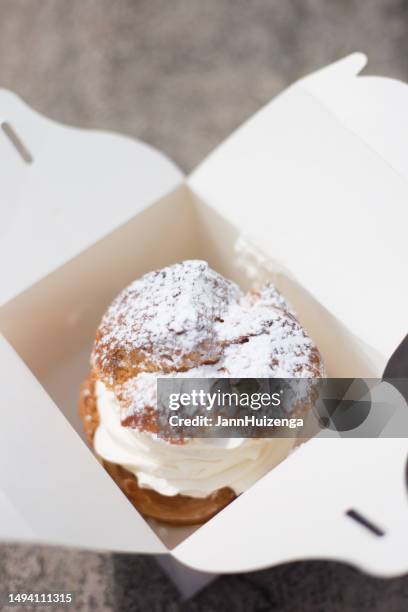 france: big vanilla cream puff in white take-away box - eclair stock pictures, royalty-free photos & images