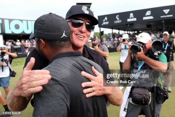 Greg Norman congratulates Harold Varner III of RangeGoats GC after Varner won the LIV Golf Invitational - DC at Trump National Golf Club on May 28,...