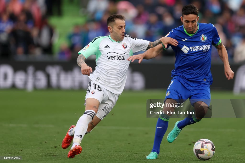 Mata of Getafe CF battles for the ball woth Ruben Peña of CA Osasuna