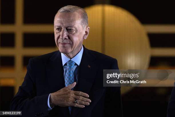 President Recep Tayyip Erdogan acknowledges supporters at the presidential palace after winning reelection in a runoff on May 29, 2023 in Ankara,...