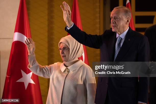 President Recep Tayyip Erdogan and wife Emine acknowledge supporters at the presidential palace after winning reelection in a runoff on May 29, 2023...