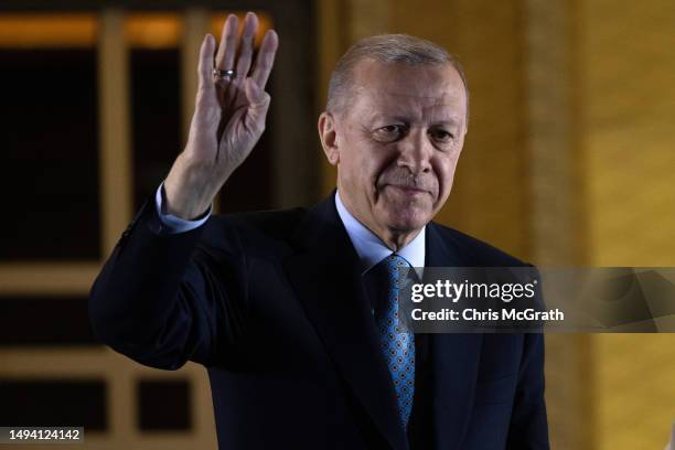 President Recep Tayyip Erdogan acknowledges supporters at the presidential palace after winning reelection in a runoff on May 29, 2023 in Ankara,...
