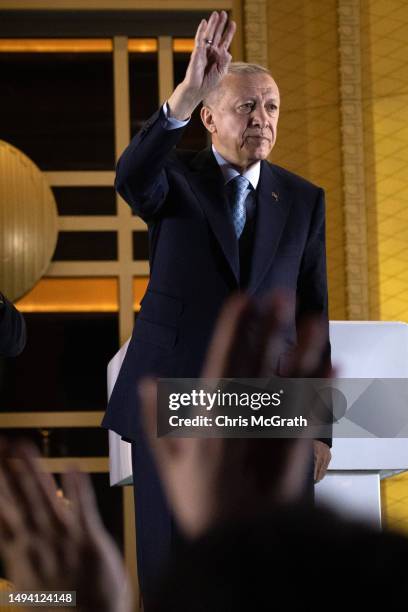 President Recep Tayyip Erdogan acknowledges supporters at the presidential palace after winning reelection in a runoff on May 29, 2023 in Ankara,...