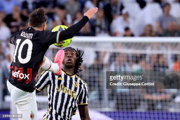 Brahim Diaz of AC Milan competes for the ball with Moise Kean of Juventus FC during the Serie A match between Juventus and AC Milan at Allianz...