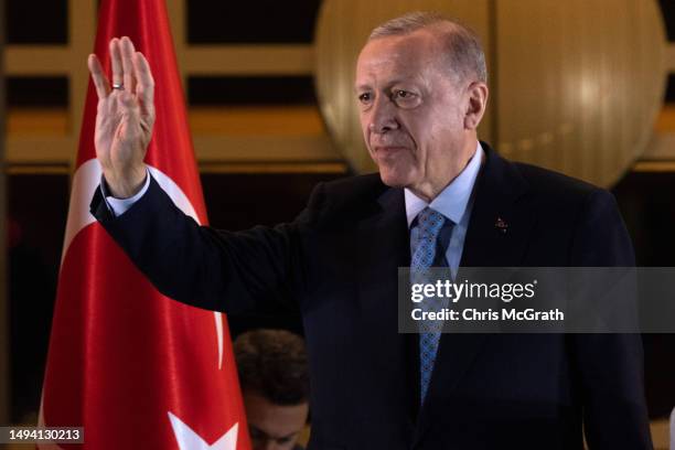 President Recep Tayyip Erdogan acknowledges supporters at the presidential palace after winning reelection in a runoff on May 29, 2023 in Ankara,...