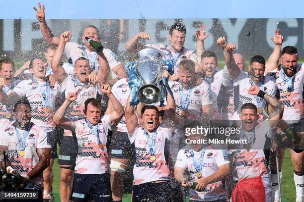 Owen Farrell of Saracens lifts the Gallagher Premiership Trophy as players of Saracens celebrate after defeating Sale Sharks during the Gallagher...