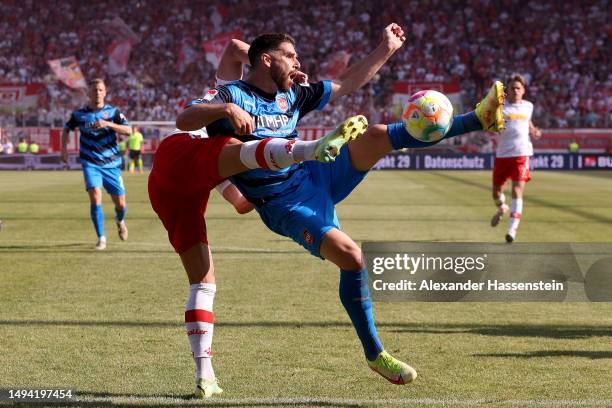 Jan Elvedi of Jahn Regensburg and Tim Kleindienst of 1. FC Heidenheim 1846 battle for the ball during the Second Bundesliga match between SSV Jahn...