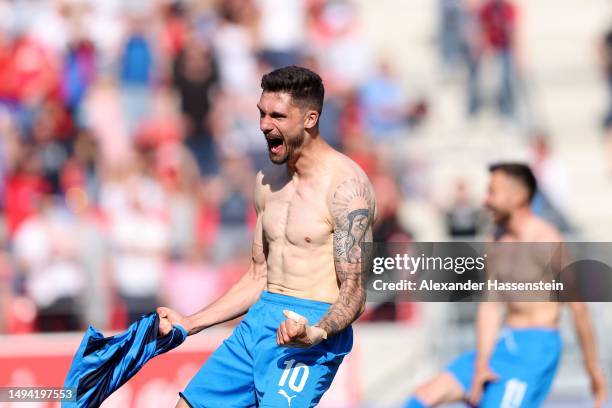 Tim Kleindienst of 1. FC Heidenheim 1846 celebrates after the team's victory and promotion to the Bundesliga in the Second Bundesliga match between...