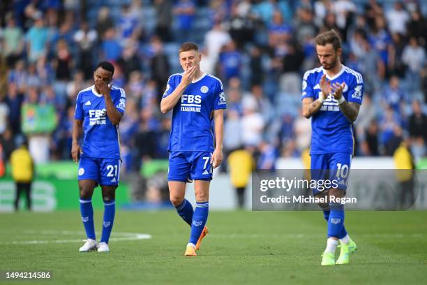 Harvey Barnes, Ricardo Pereira and James Maddison of Leicester look dejected after being relegated after the Premier League match between Leicester...