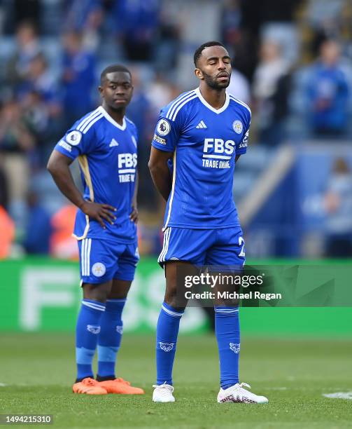 Ricardo Pereira and Nampalys Mendy of Leicester look dejected after being relegated following the Premier League match between Leicester City and...