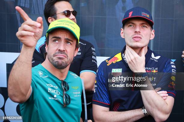 Max Verstappen of Netherland and Oracle Red Bull Racing and Fernando Alonso of Spain and Aston Martin speaks during the F1 Grand Prix of Monaco at...