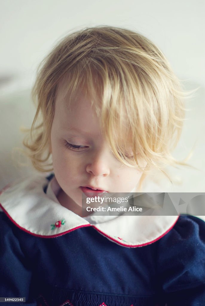 Quiet toddler girl in vintage dress