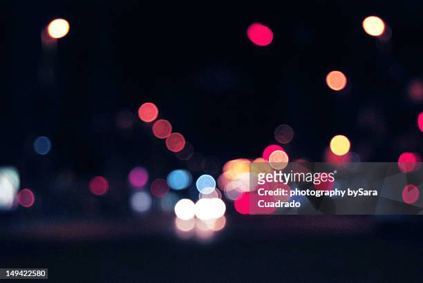 city lights - bokeh light stock-fotos und bilder