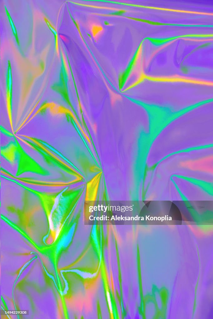 Abstract neon colored purple, turquoise, mint green, orange, pink metallic psychedelic holographic wrinkled foil texture. Bold bright neon colored Futuristic, retro, Dream Punk, Acidwave, Dreamcore, Retro-Futurism, 80s, 90s, y2k, holosexual background.