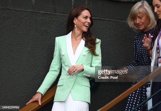 Catherine, Princess of Wales is accompanied by former players Debbie Jevans and Laura Robson as they walk through the grounds on day two of the...