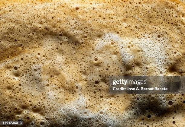 full frame, cream of a cappuccino coffee. - crema stock pictures, royalty-free photos & images