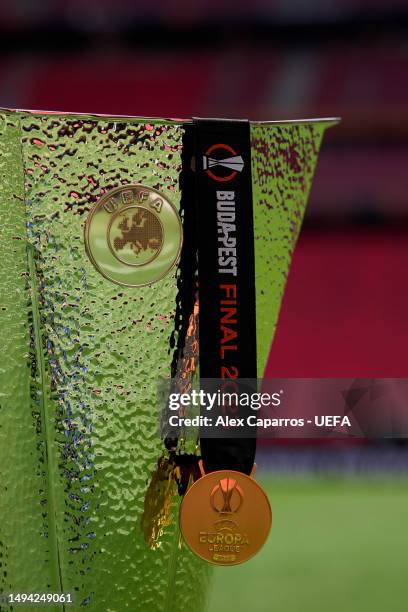View of a UEFA Europa League winners' medal with the UEFA Europa League trophy prior to the UEFA Europa League 2022/23 final match between Sevilla FC...