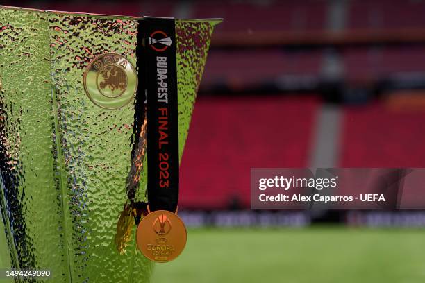 View of a UEFA Europa League winners' medal with the UEFA Europa League trophy prior to the UEFA Europa League 2022/23 final match between Sevilla FC...