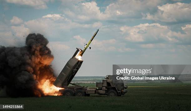 Launches a rocket on the Bakhmut direction on May 18, 2023 in Donetsk Oblast, Ukraine. Ukraine received the HIMARS as part of international military...