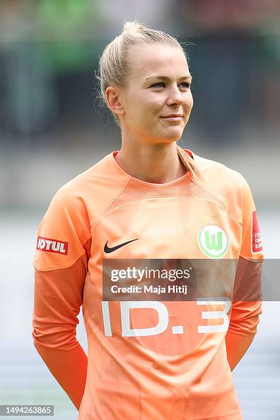 Merle Fromms Merle Frohms of VfL Wolfsburg looks on prior to the FLYERALARM... News ...
