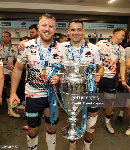 Alex Lozowski and Jackson Wray of Saracens pose with the Premiership Trophy after their victory during the Gallagher Premiership Final between...