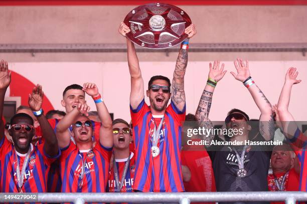 Tim Kleindienst of FC Heidenheim lifts the Meisterschale trophy at the celebration party at Voith-Arena on May 29, 2023 in Heidenheim, Germany. The...