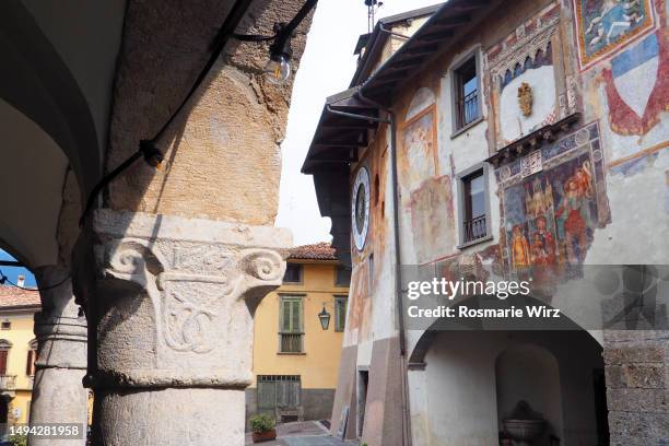 clusone main square with astronomical clock - fresco stock pictures, royalty-free photos & images