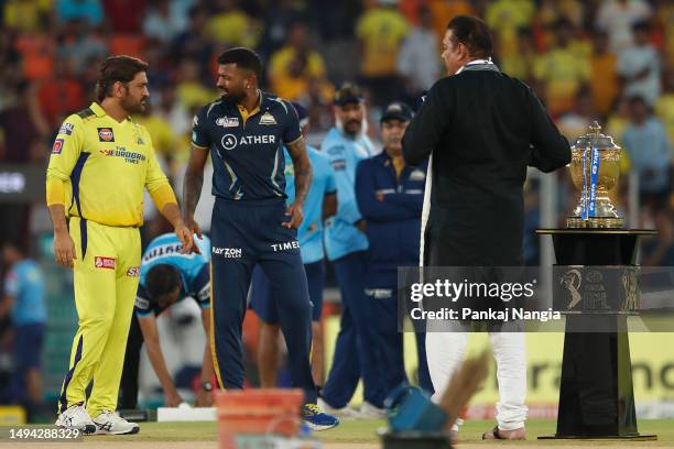 Dhoni of the Chennai Super Kings and Hardik Pandya of the Gujarat Titans talk at the coin toss during the 2023 IPL Final match between Chennai Super...