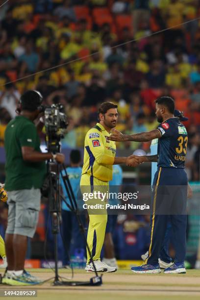 Dhoni of the Chennai Super Kings and Hardik Pandya of the Gujarat Titans shakes hands followinduring the 2023 IPL Final match between Chennai Super...