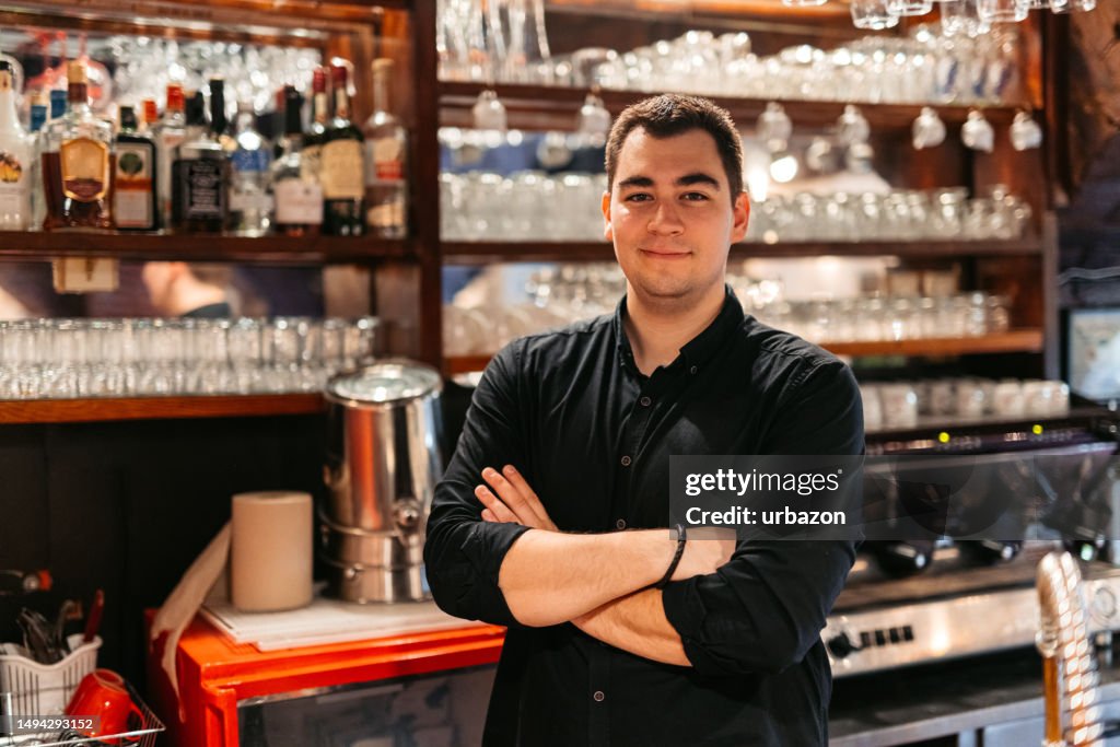 Bartender Behind A Bar Counter