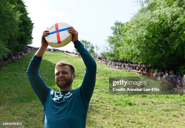 Matt Crolla, aged 28 from Salford, wins the first men's downhill Cooper's Hill Cheese race on May 29, 2023 in Gloucester, United Kingdom. This year,...