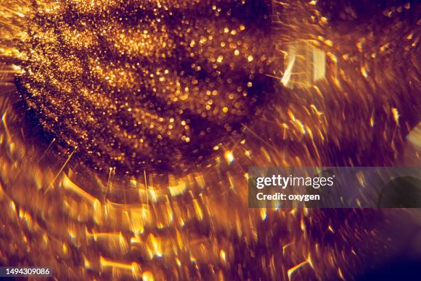 abstract glitter gold blured bokeh light background. christmas holiday, new year luxury pattern macro with shadow cell texture - precious gem stock pictures, royalty-free photos & images