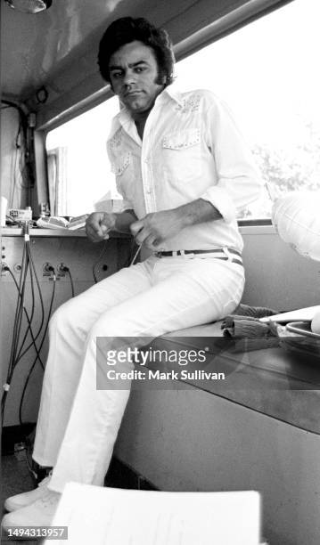 Singer Johnny Mathis duing a KMPC radio station promotion in Los Angeles, CA 1975.