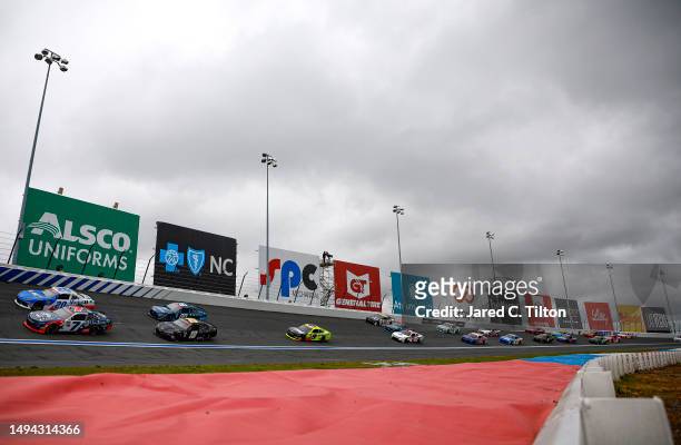 Justin Allgaier, driver of the Unilever Military DeCA RCPT Chevrolet, and John Hunter Nemechek, driver of the Mobil 1 Toyota, lead the field on a...
