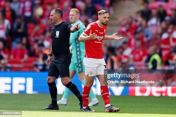 Adam Phillips of Barnsley reacts after receiving a red card from Referee Tim Robinson during the Sky Bet League One Play-Off Final between Barnsley...