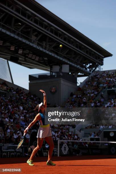 Belinda Bencic of Switzerland serves against Elina Avanesyan during their Women's Singles First Round Match on Day Two of the 2023 French Open at...