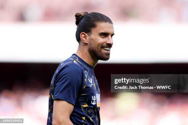 Ruben Neves of Wolverhampton Wanderers warms up ahead of the Premier League match between Arsenal FC and Wolverhampton Wanderers at Emirates Stadium...