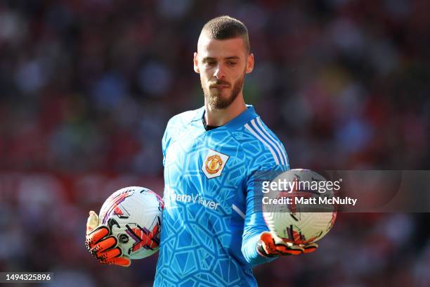 David De Gea of Manchester United holds two match balls during the Premier League match between Manchester United and Fulham FC at Old Trafford on...