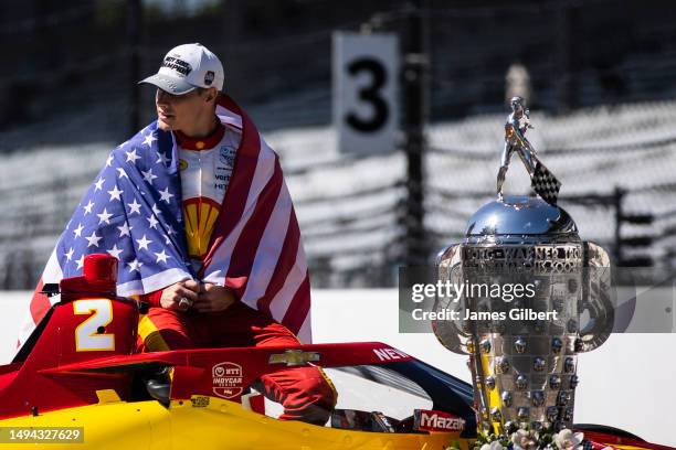 Josef Newgarden, driver of the PPG Team Penske Chevrolet, looks on during the 107th Indianapolis 500 champion's portraits at Indianapolis Motor...