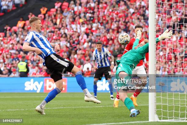 Michael Smith of Sheffield Wednesday has his shot saved by Harvey Isted of Barnsley during the Sky Bet League One Play-Off Final between Barnsley and...