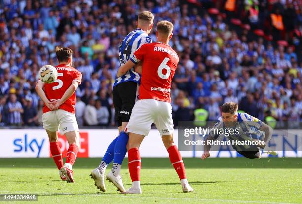 Josh Windass of Sheffield Wednesday scores the team's first goal during the Sky Bet League One Play-Off Final between Barnsley and Sheffield...