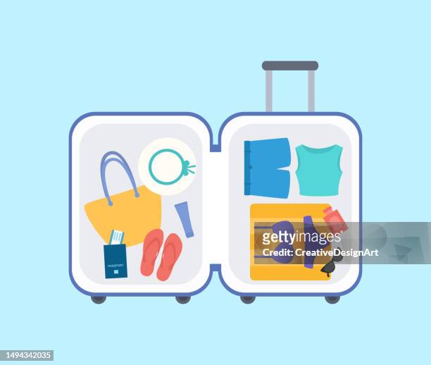 high angle view of open suitcase with clothes, swimwear, towel, sunglasses and passport. summer vacation concept - open suitcase stock illustrations