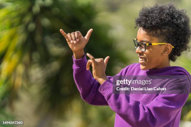 african american boy make call me back sign - call me hand sign stock pictures, royalty-free photos & images