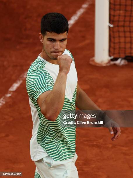 Carlos Alcaraz of Spain celebrates winning match point against Flavio Cobolli of Italy during their Men's Singles First Round Match on Day Two of the...