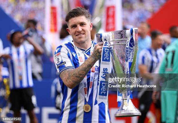 Josh Windass of Sheffield Wednesday celebrates with the trophy after the team's victory and promotion to the Sky Bet Championship in the Sky Bet...