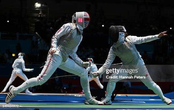 Monica Peterson of Canada competes with Anna Bentley of Great Britain in their Women's Foil Individual Round of 64 match on day one of the London...